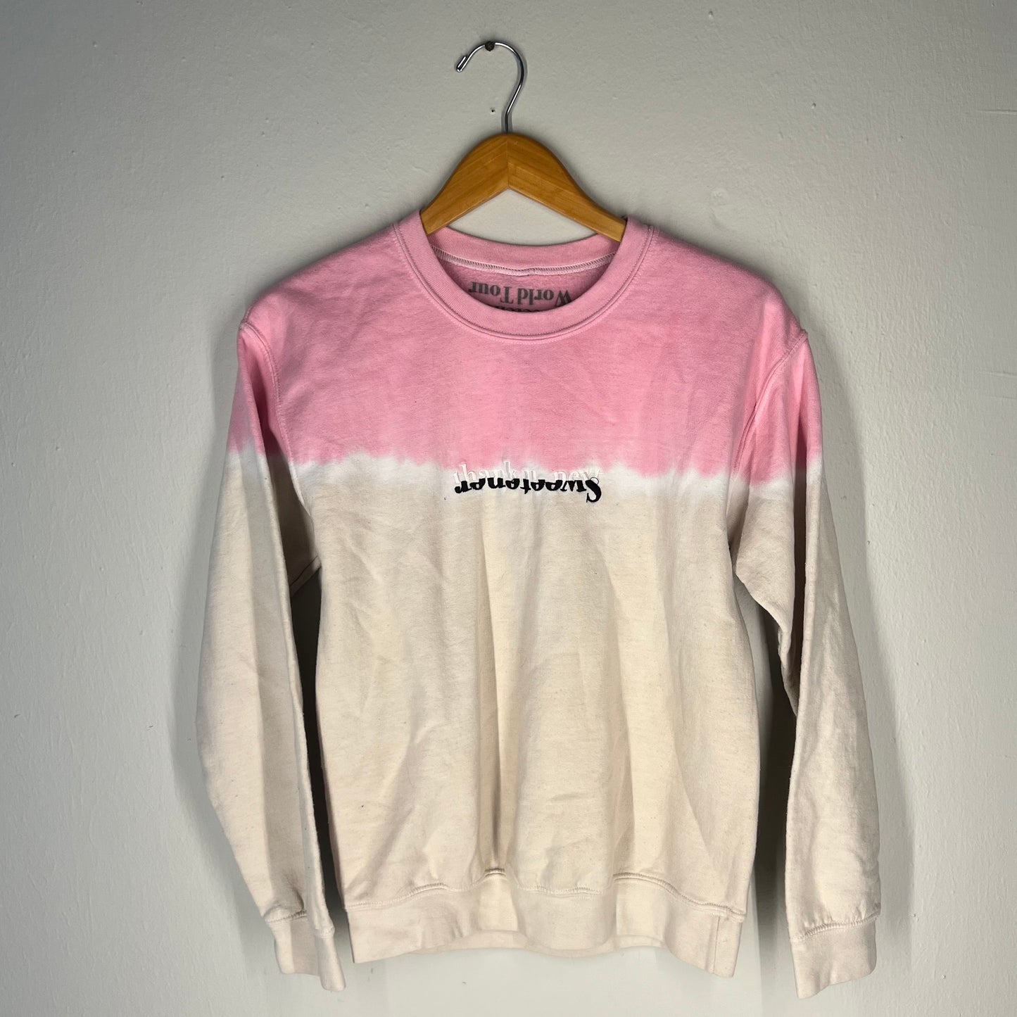 Front view of Ariana Grande Sweetener World Tour dip-dye crewneck (pink/white, S)