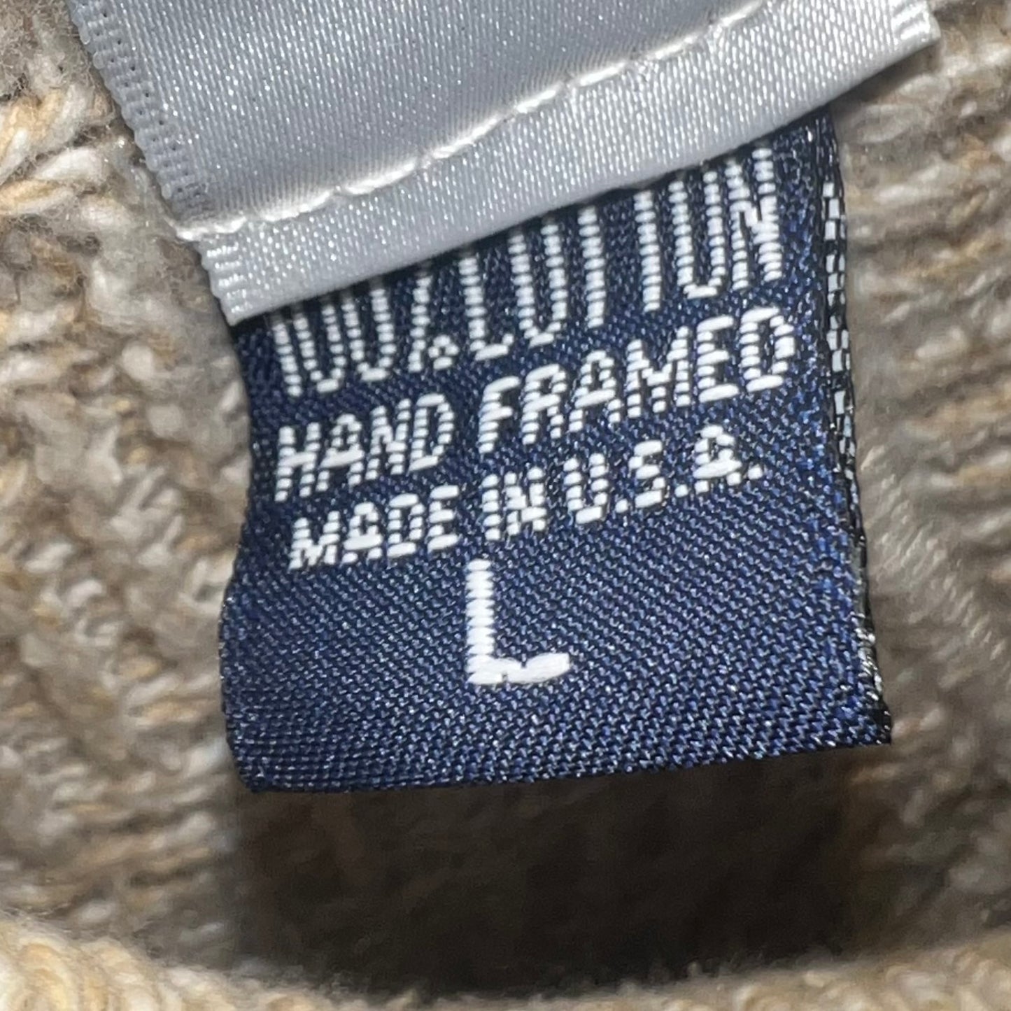 Inner tag reading “Hand Framed, Made in U.S.A., L