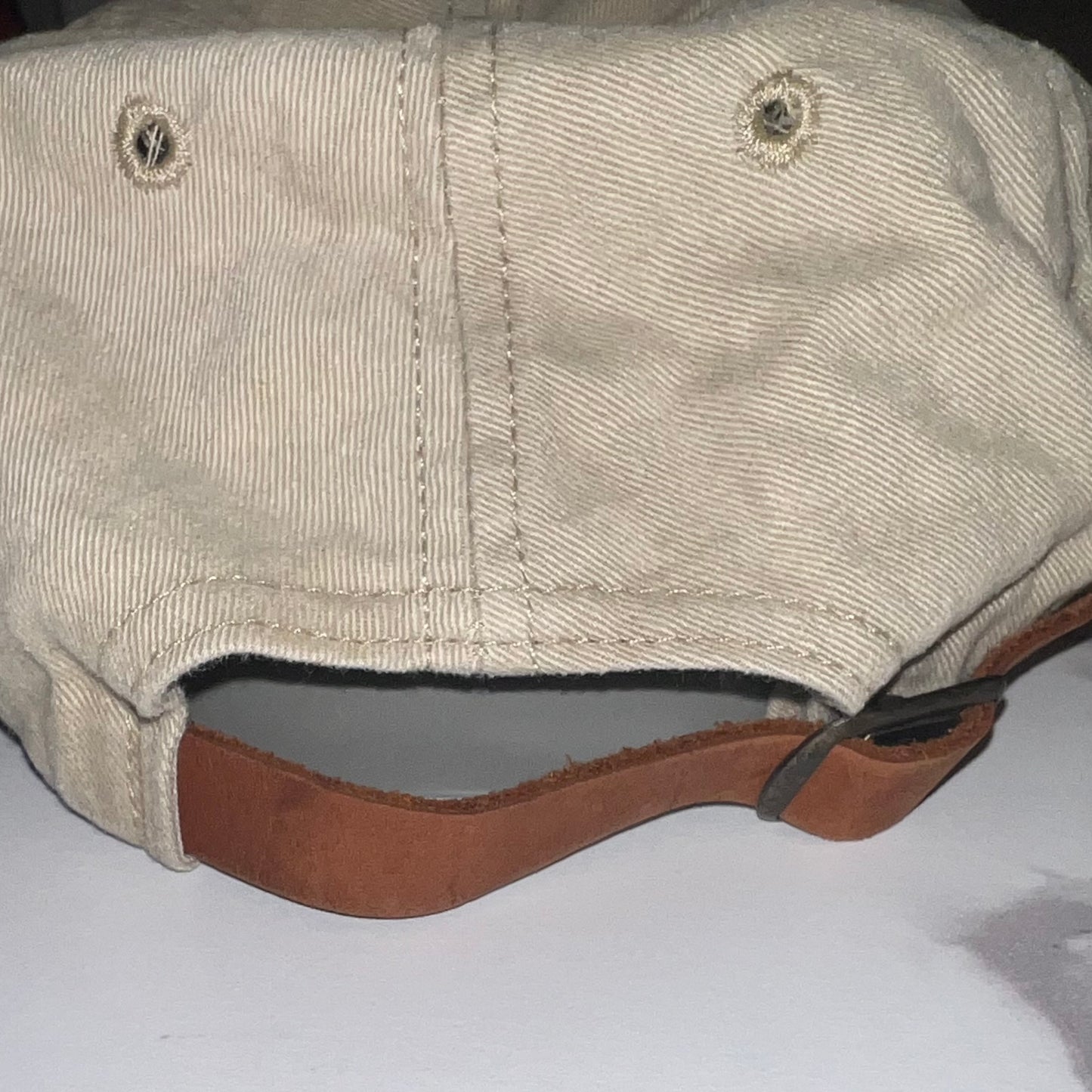 Rear view with genuine leather strap and brass buckle closure
