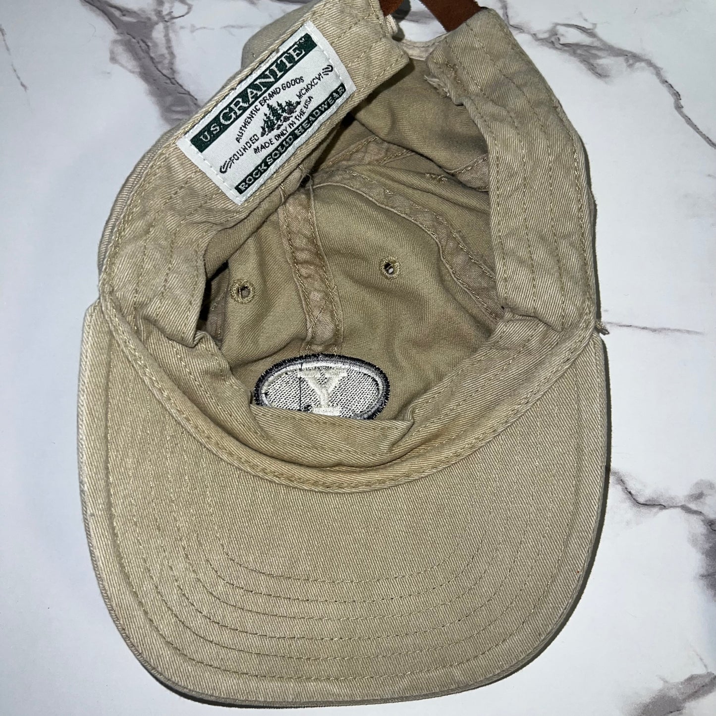 Interior view showing U.S. Granite woven label and sweatband
