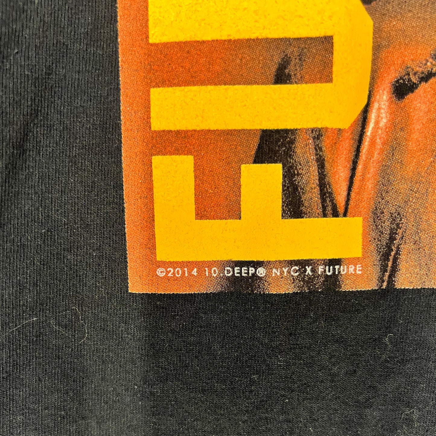 Close-up of ©2014 10.Deep NYC x Future copyright below graphic print