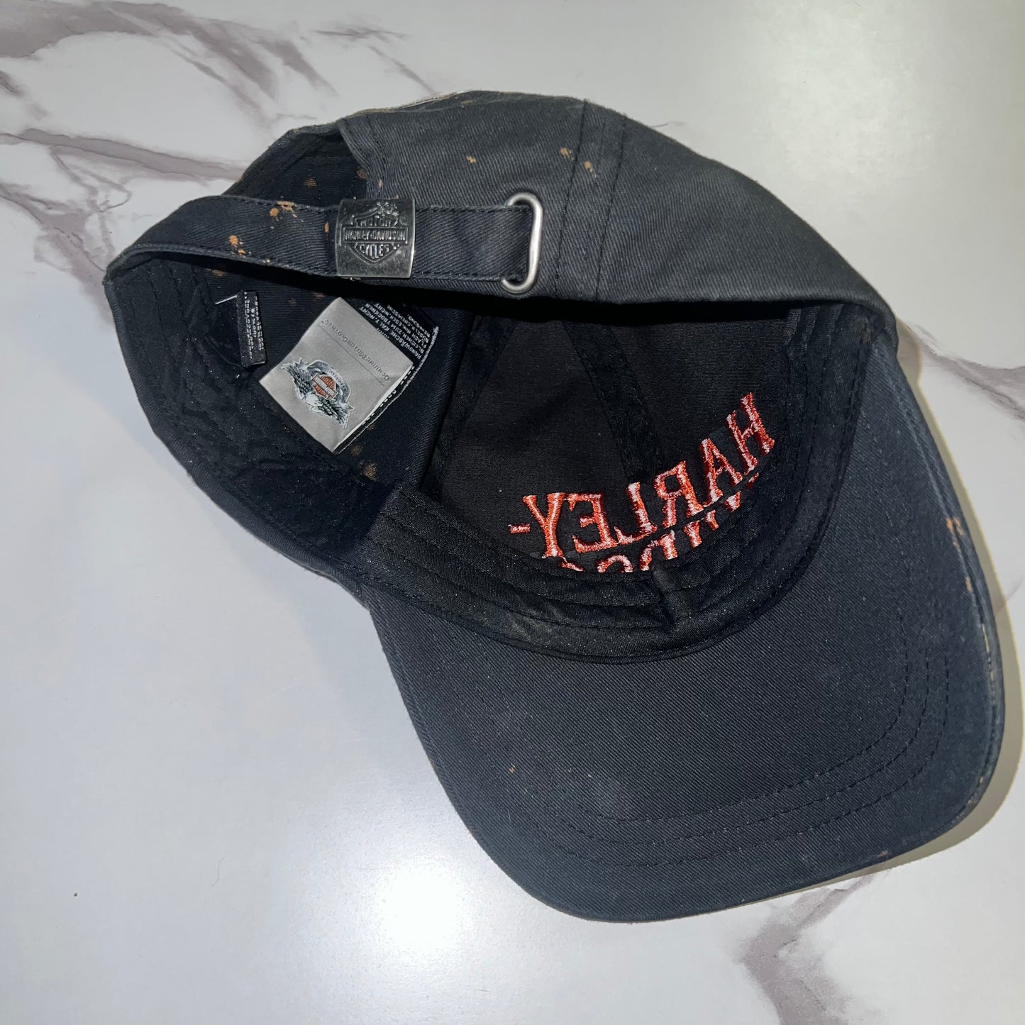 Interior construction view of adjustable strap and labels