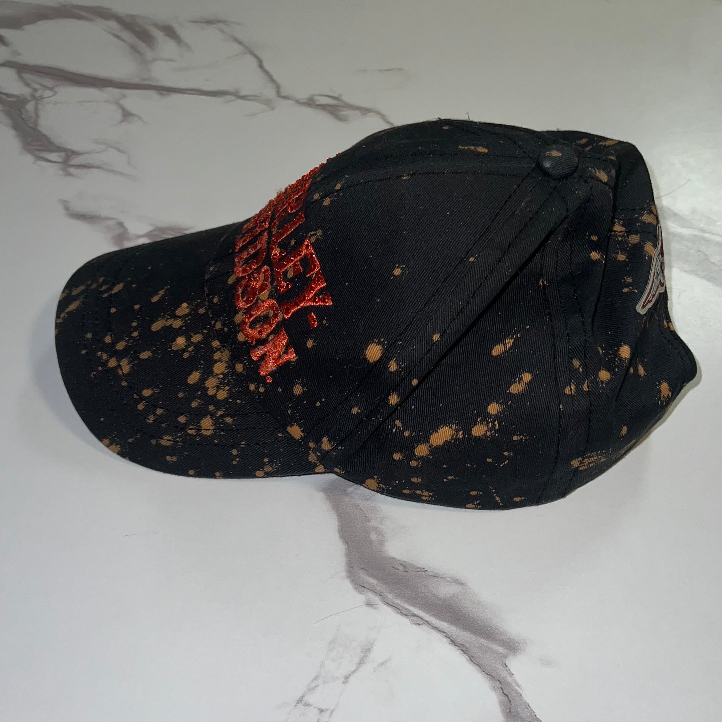 Side angle view showing distressed bleach wash pattern