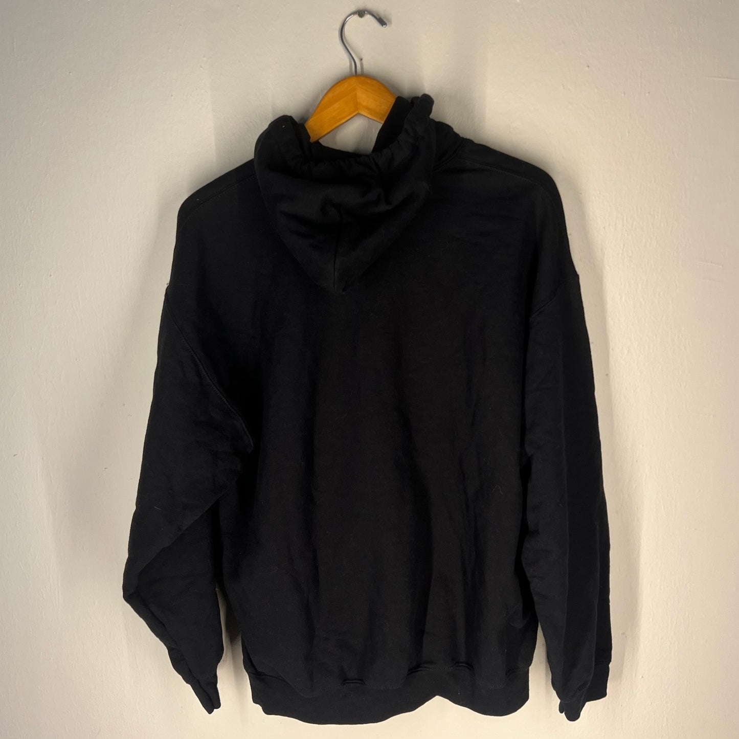 Back view of plain black Hozier hoodie
