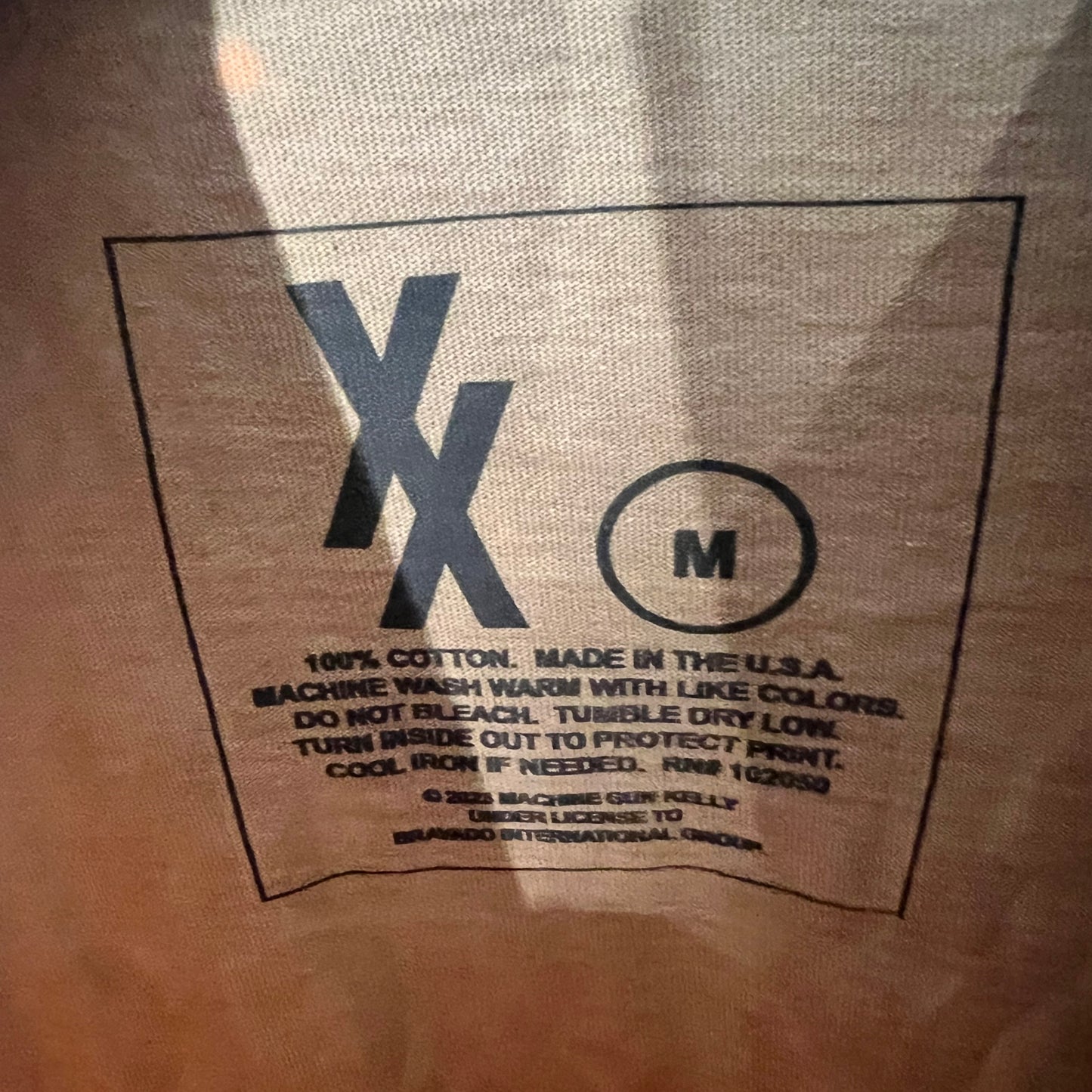 nside tag showing Made in USA, size M, 100% cotton
