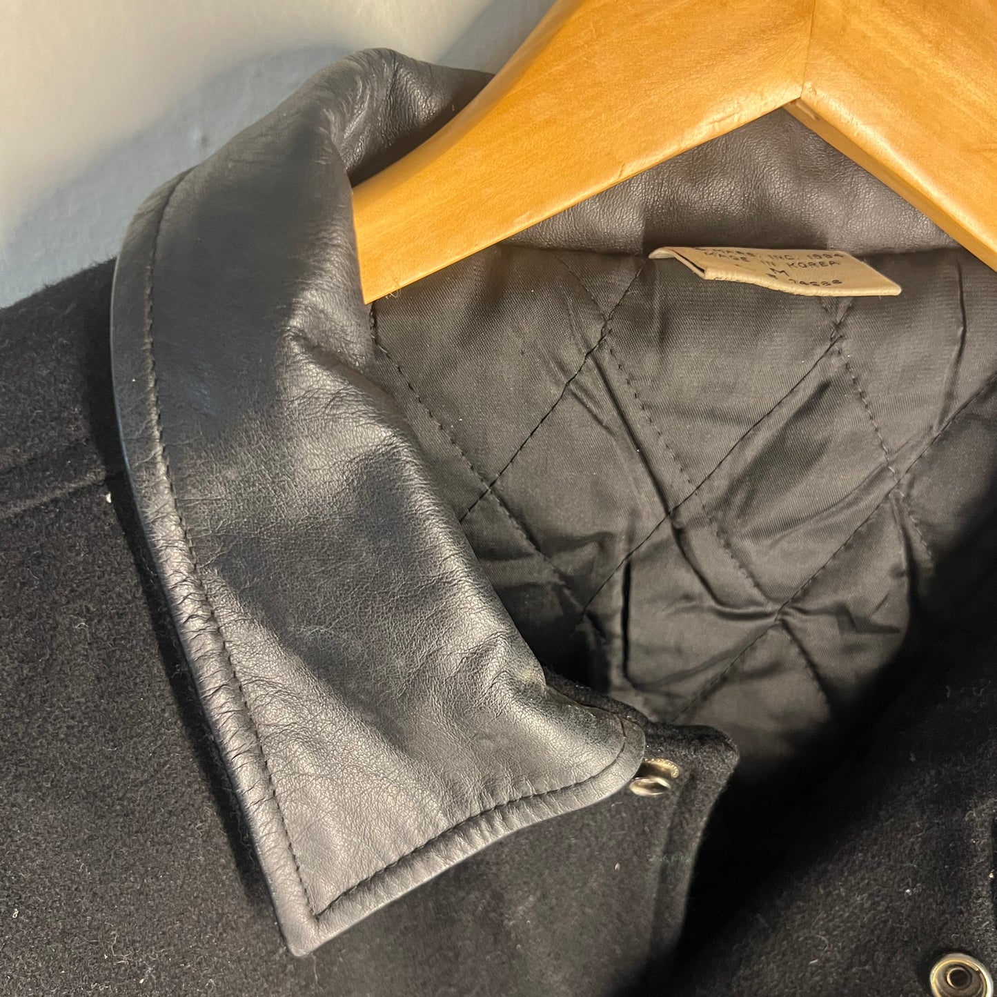 Leather collar and quilted interior detail