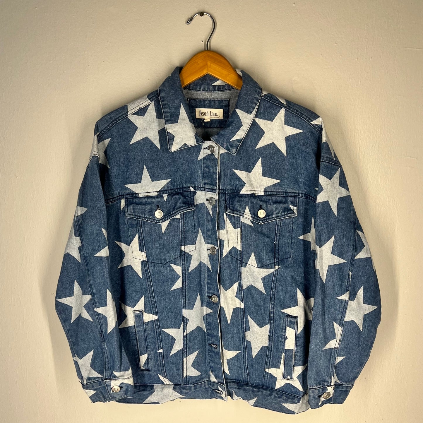 Front view of Peach Love California star print denim jacket (blue, size S)