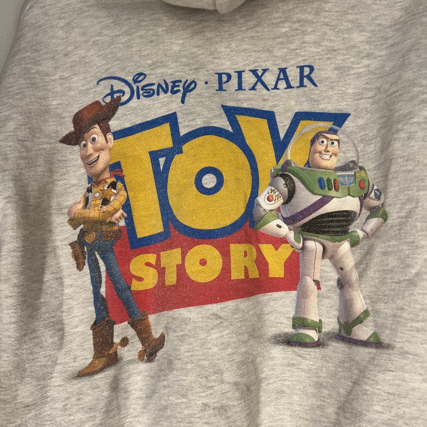 Close-up of Toy Story back graphic with Woody and Buzz