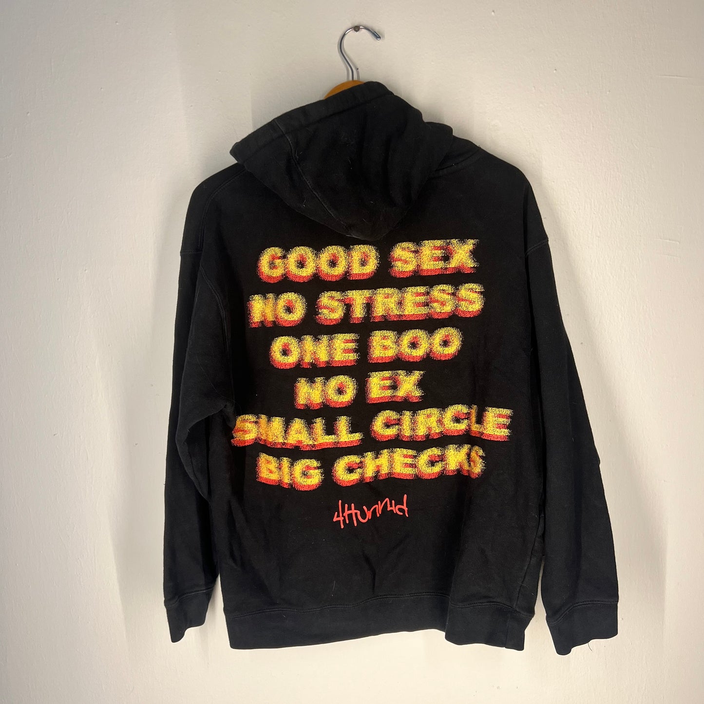 Back view with bold multicolor “Good Sex No Stress” graphic