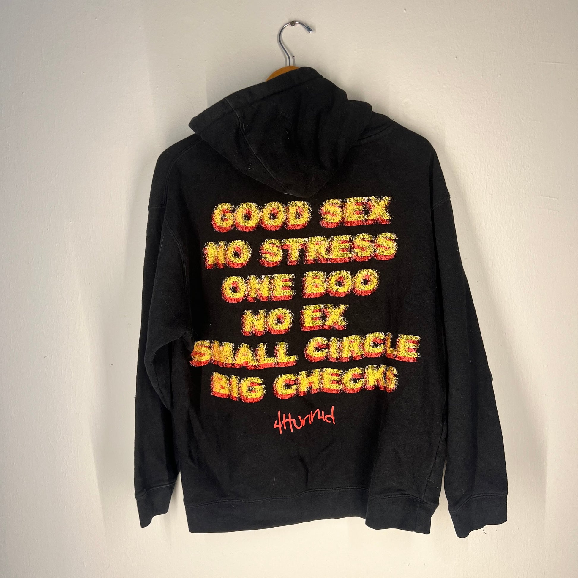 Back view with bold multicolor “Good Sex No Stress” graphic