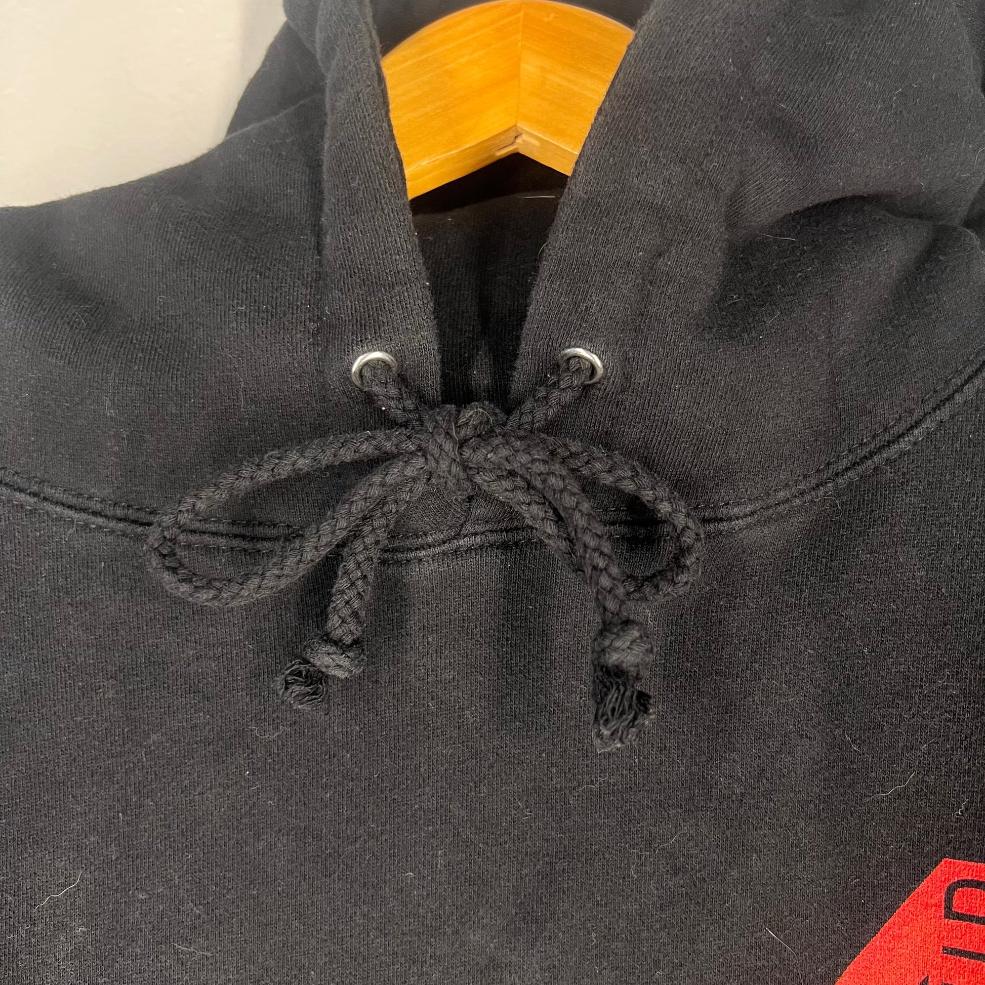 Detail of hoodie drawstrings and neckline