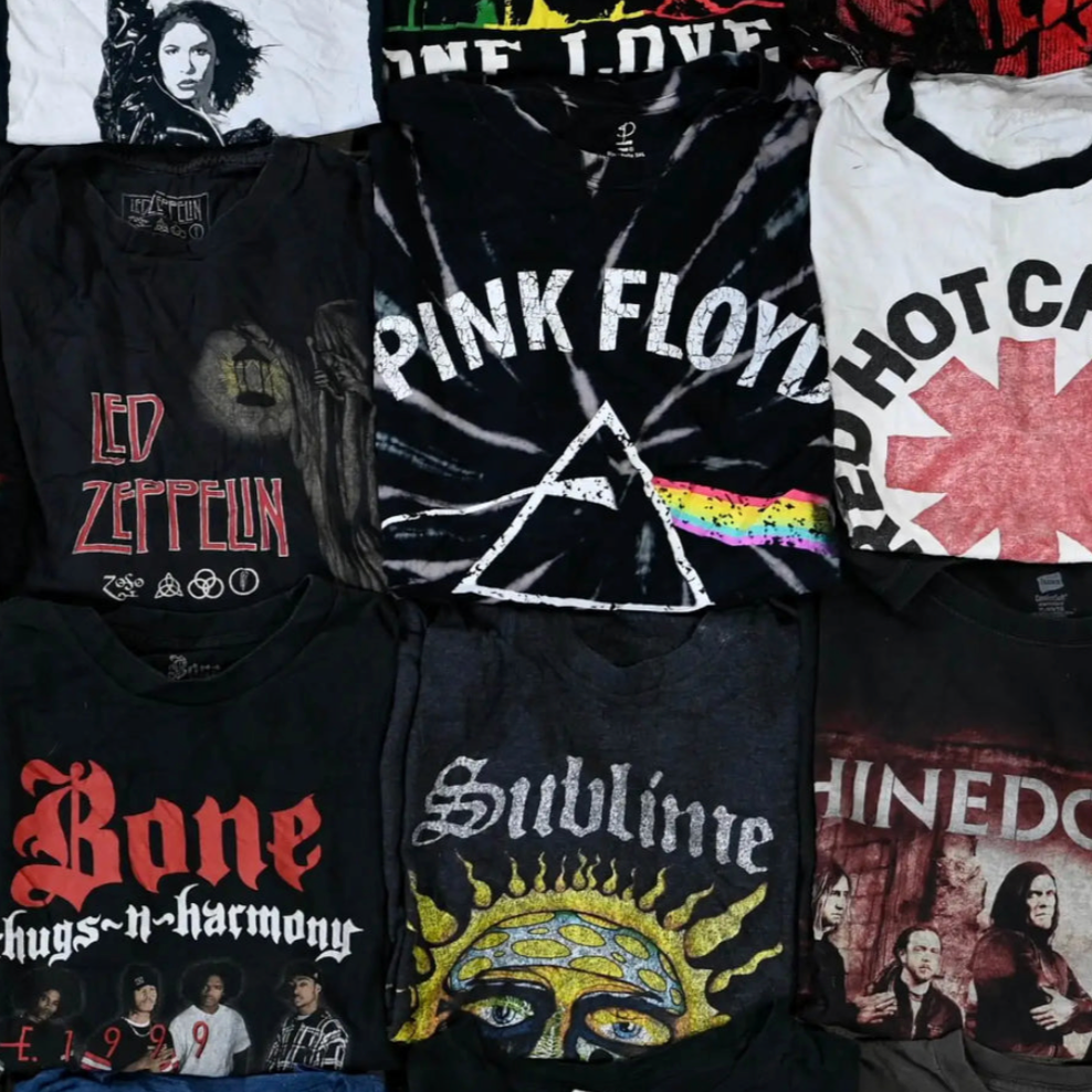 Flat lay of assorted vintage-style band t-shirts including Pink Floyd, Tupac, and Sublime for 5-pack mystery bundle. Designs may vary.