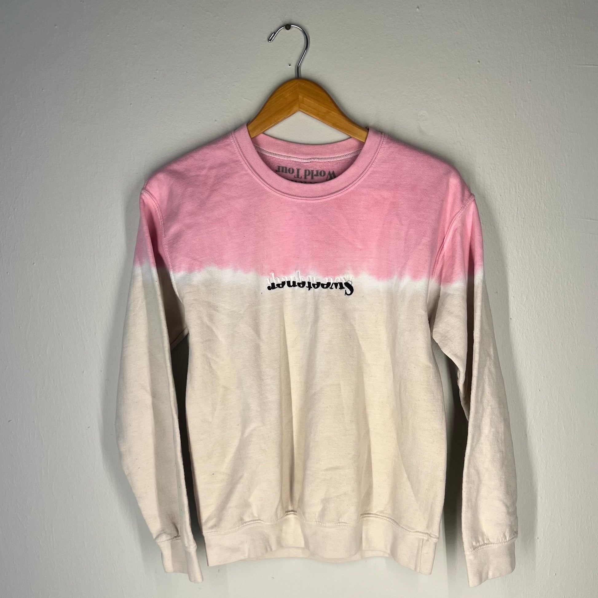 Front view of Ariana Grande Sweetener World Tour dip-dye crewneck (pink/white, S)