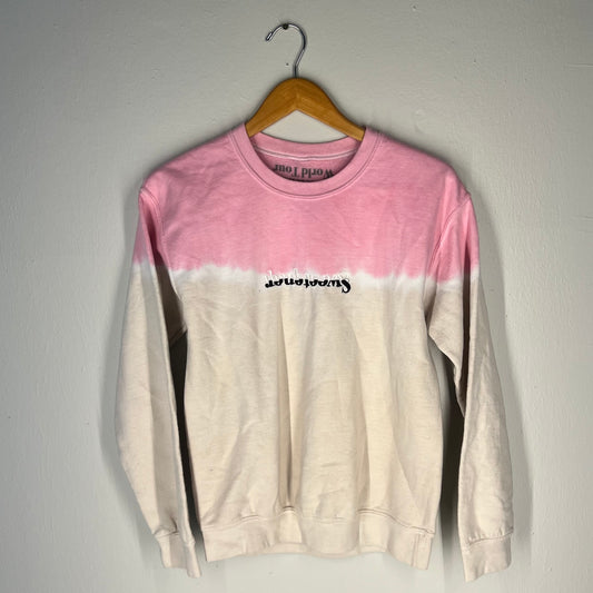 Front view of Ariana Grande Sweetener World Tour dip-dye crewneck (pink/white, S)