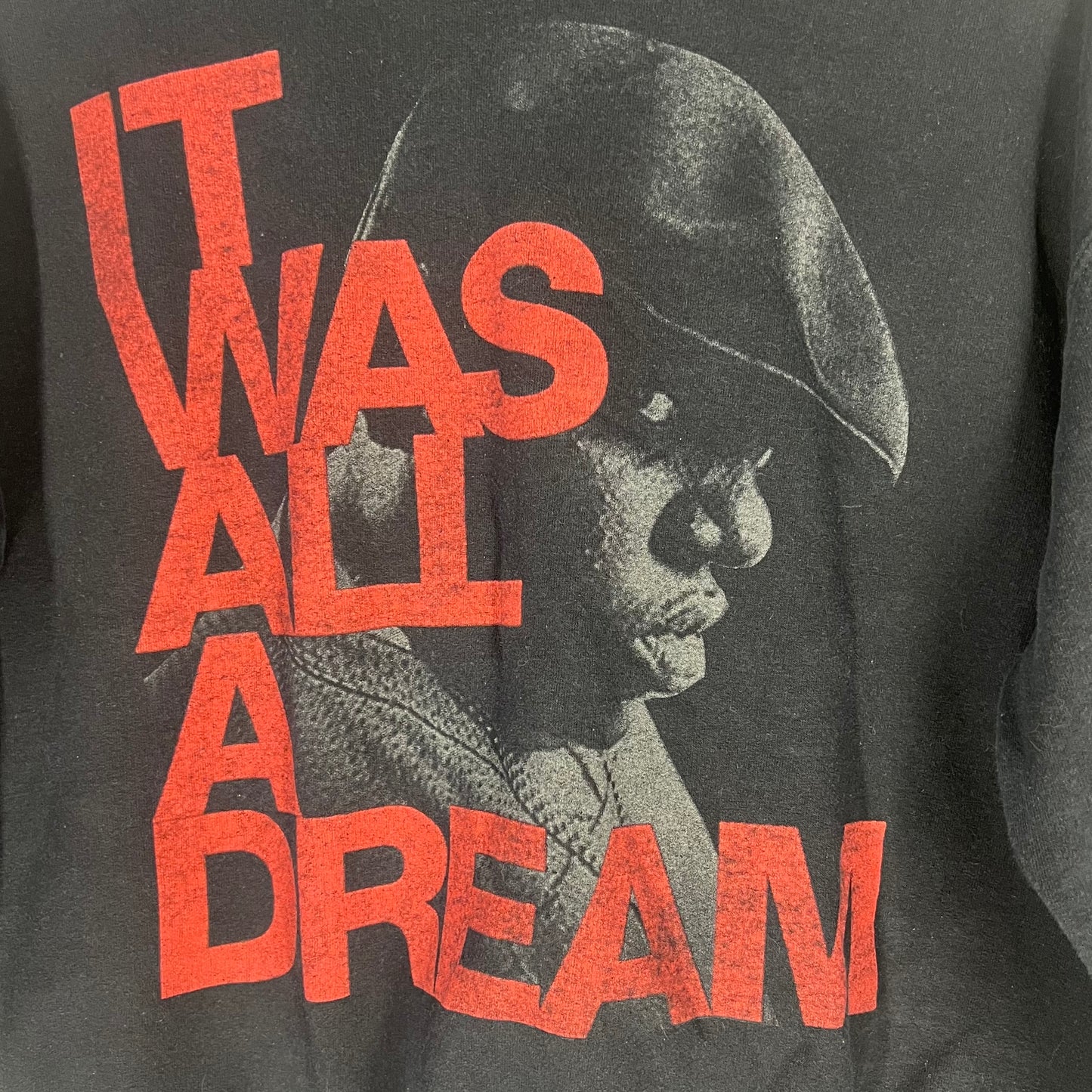 Close-up of red text “It Was All a Dream” with Biggie Smalls portrait graphic