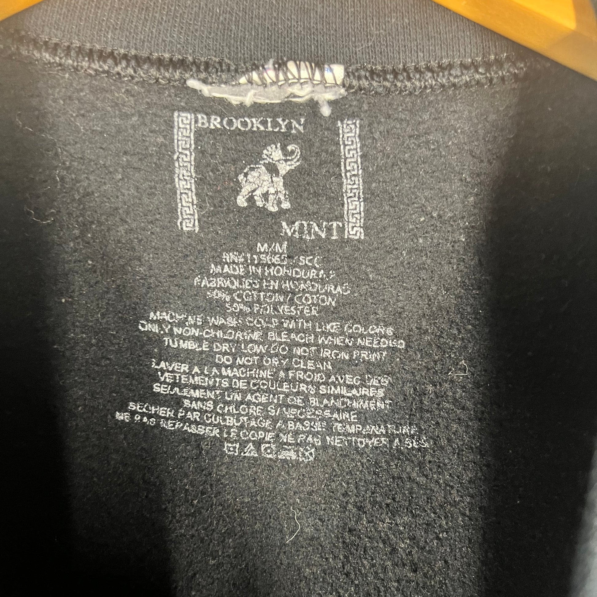 Brooklyn Mint printed neck tag with size M and fabric details