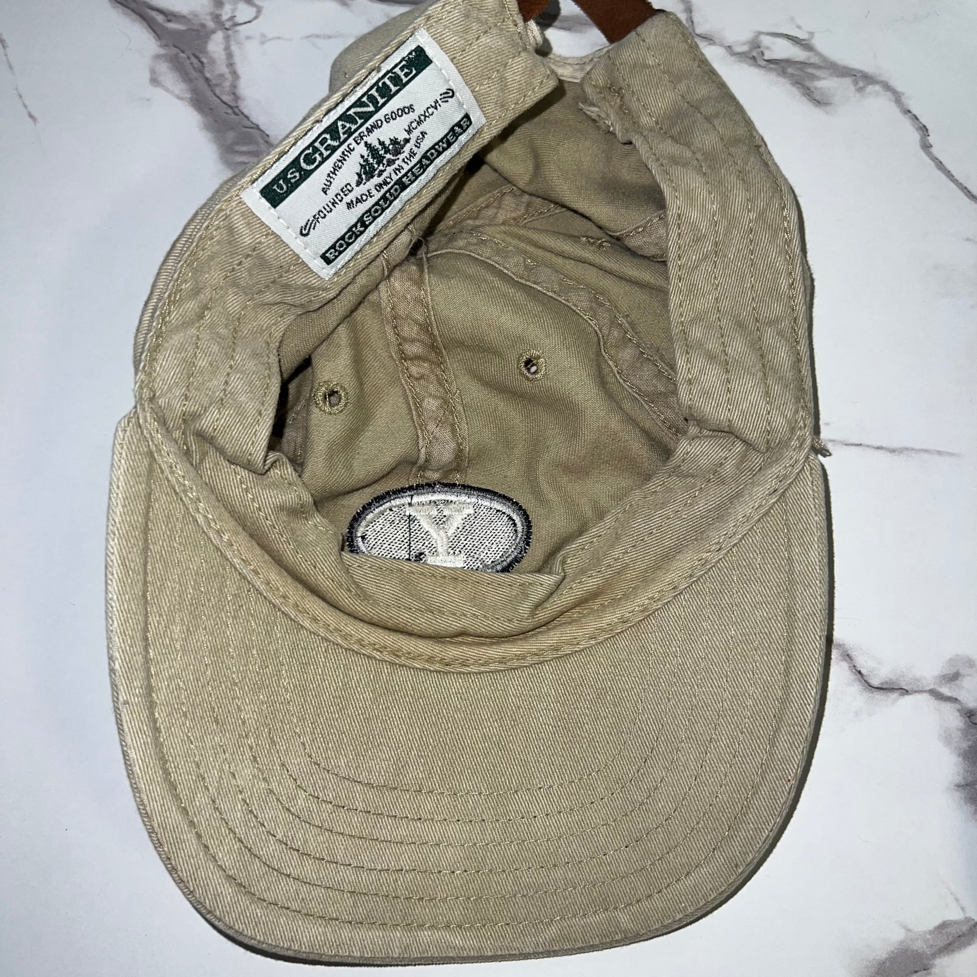 Interior view showing U.S. Granite woven label and sweatband