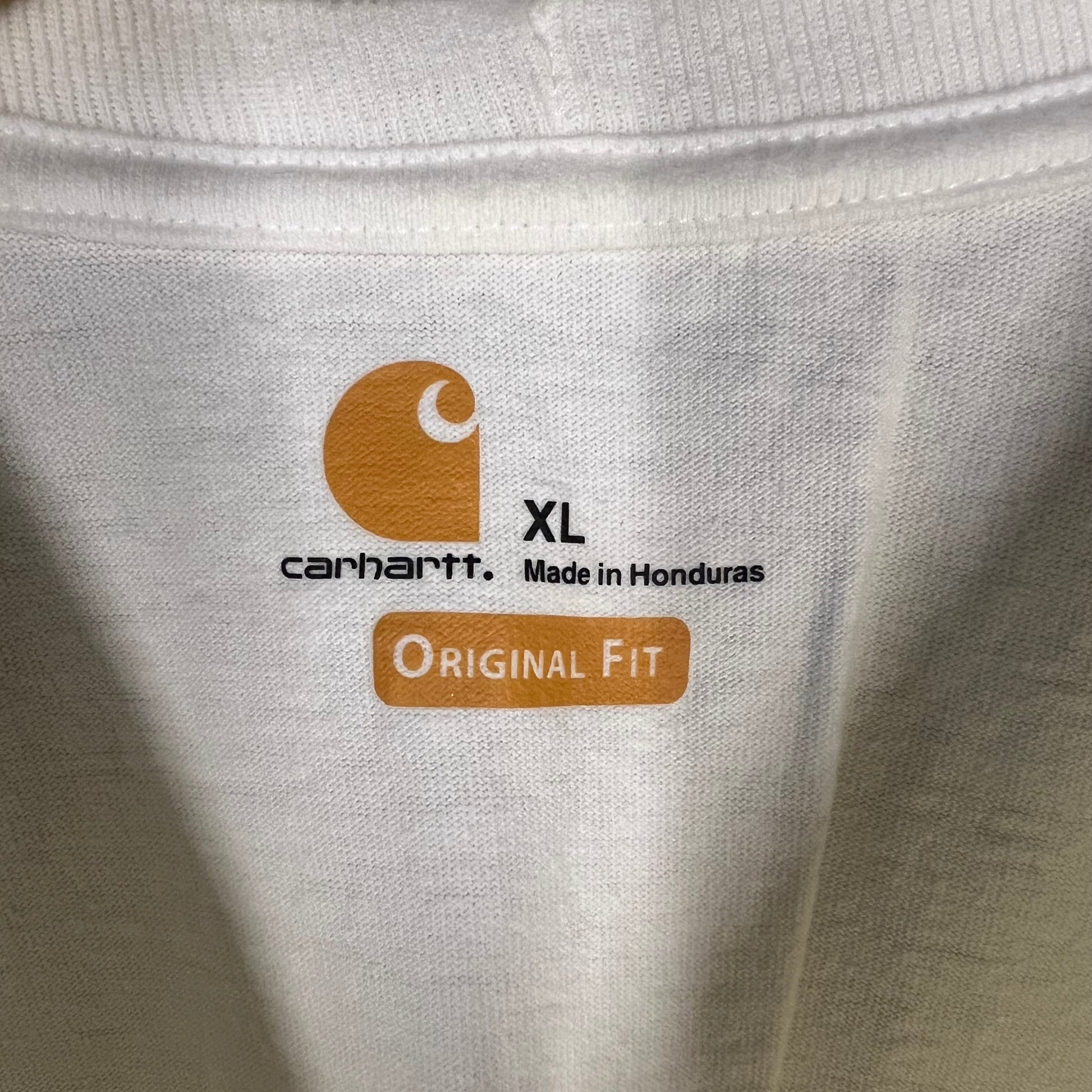 Neck tag close-up of Carhartt Original Fit XL made in Honduras