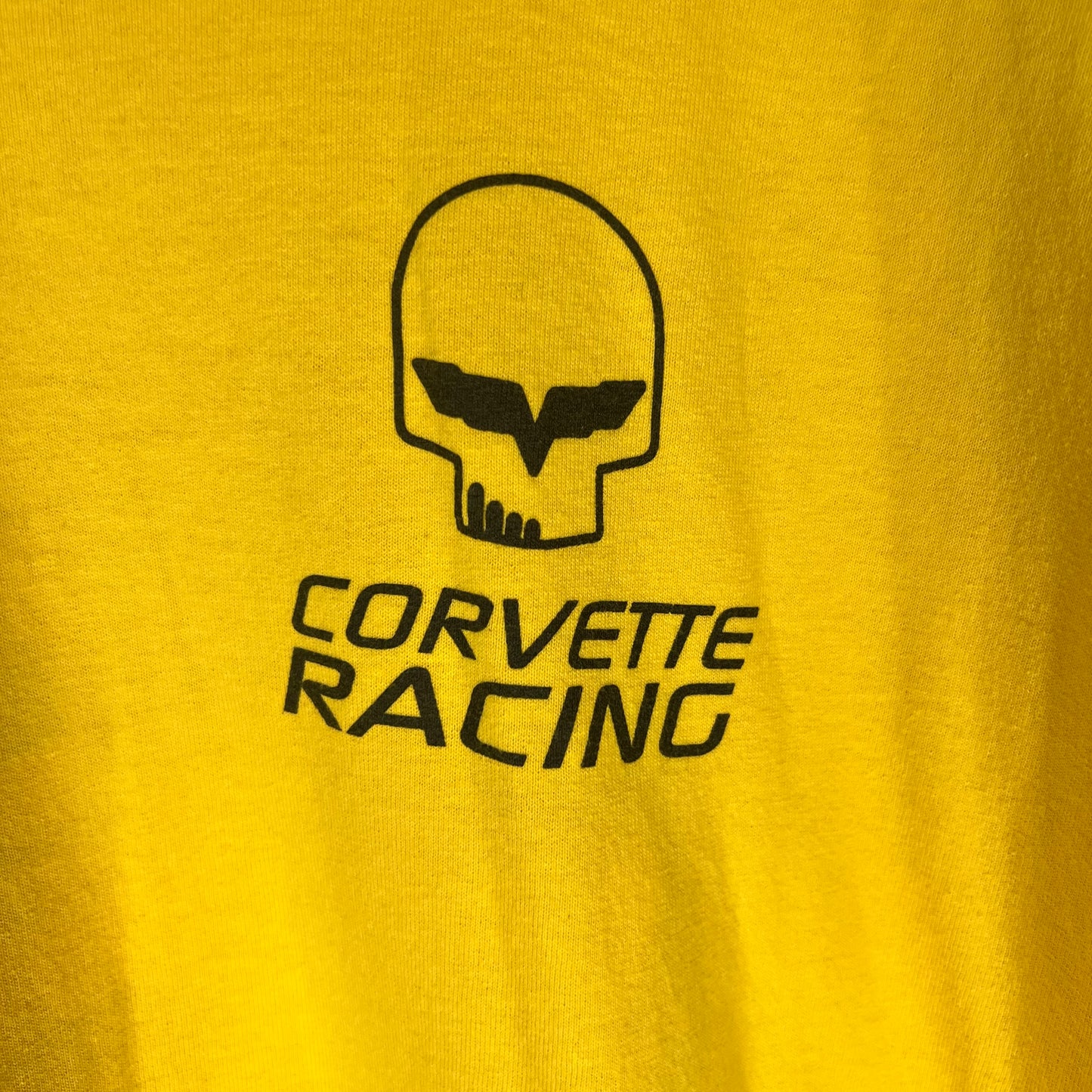 Close-up of Corvette Racing skull logo graphic on front chest