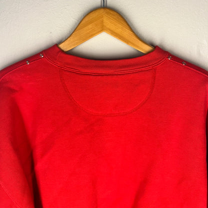 Close-up of back neckline and shoulder stud details