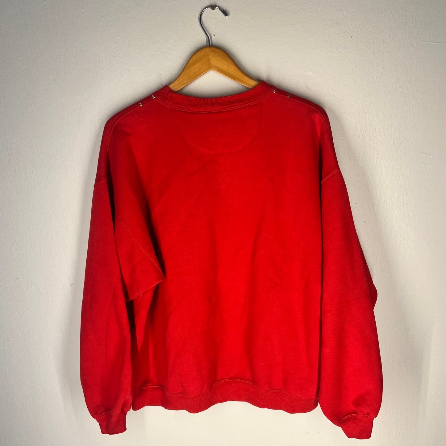 Back view of sweatshirt (solid red, no graphic)