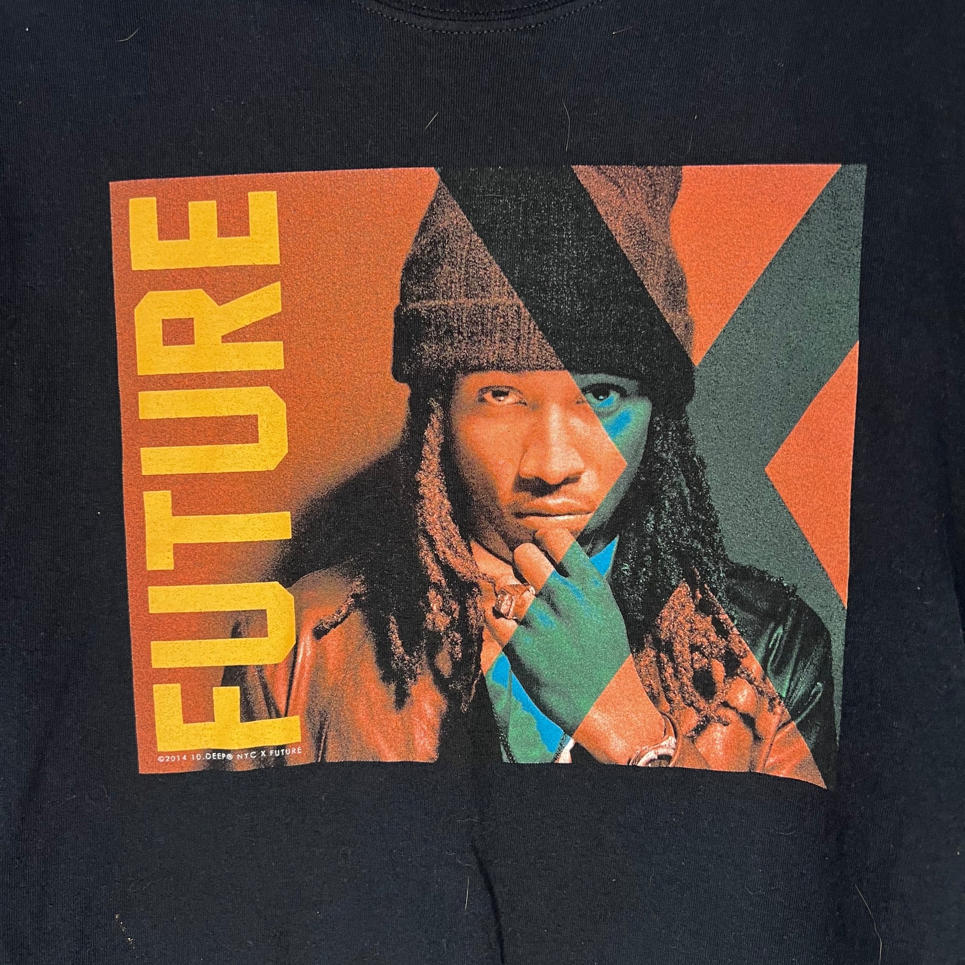 Black t-shirt with a graphic of a person with dreadlocks and the word 'FUTURE' on a colorful background.