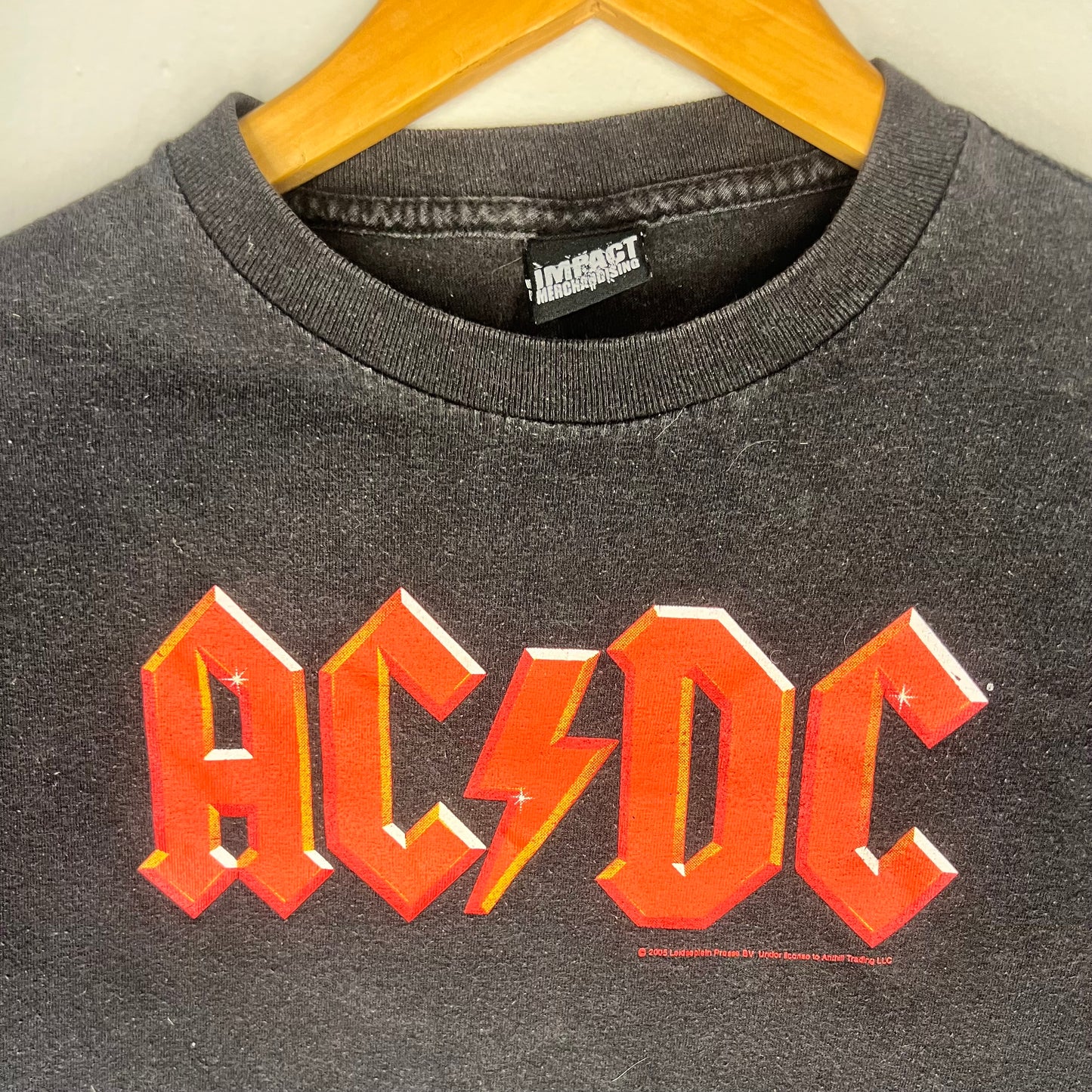Close-up of AC/DC red logo on chest of 2005 vintage band t-shirt