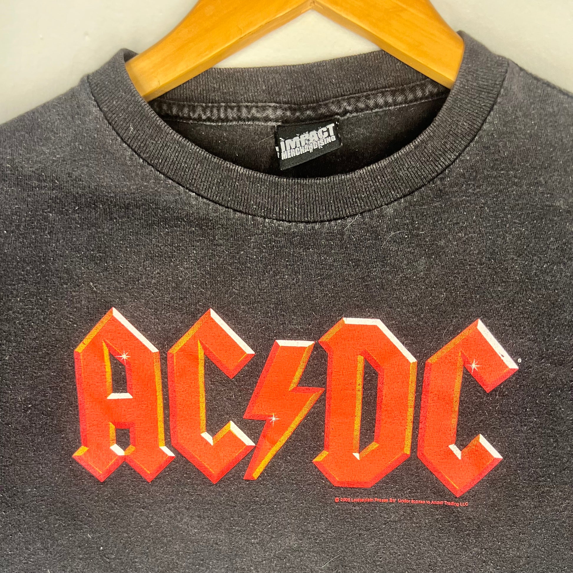 Close-up of AC/DC red logo on chest of 2005 vintage band t-shirt