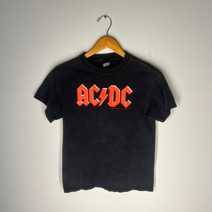 Full front view of faded black 2005 AC/DC band tee hanging on wooden hanger