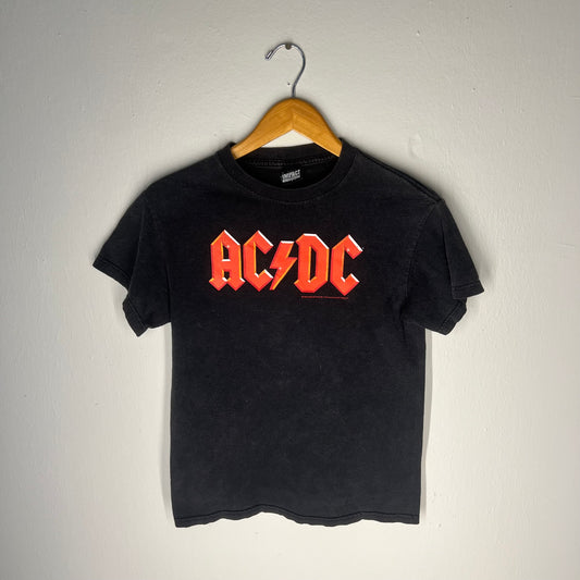 Full front view of faded black 2005 AC/DC band tee hanging on wooden hanger