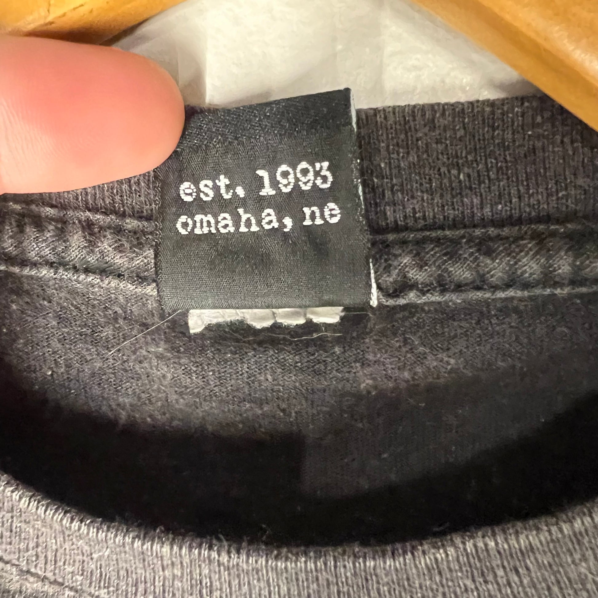 Secondary inside neck tag reading est. 1993 Omaha, NE