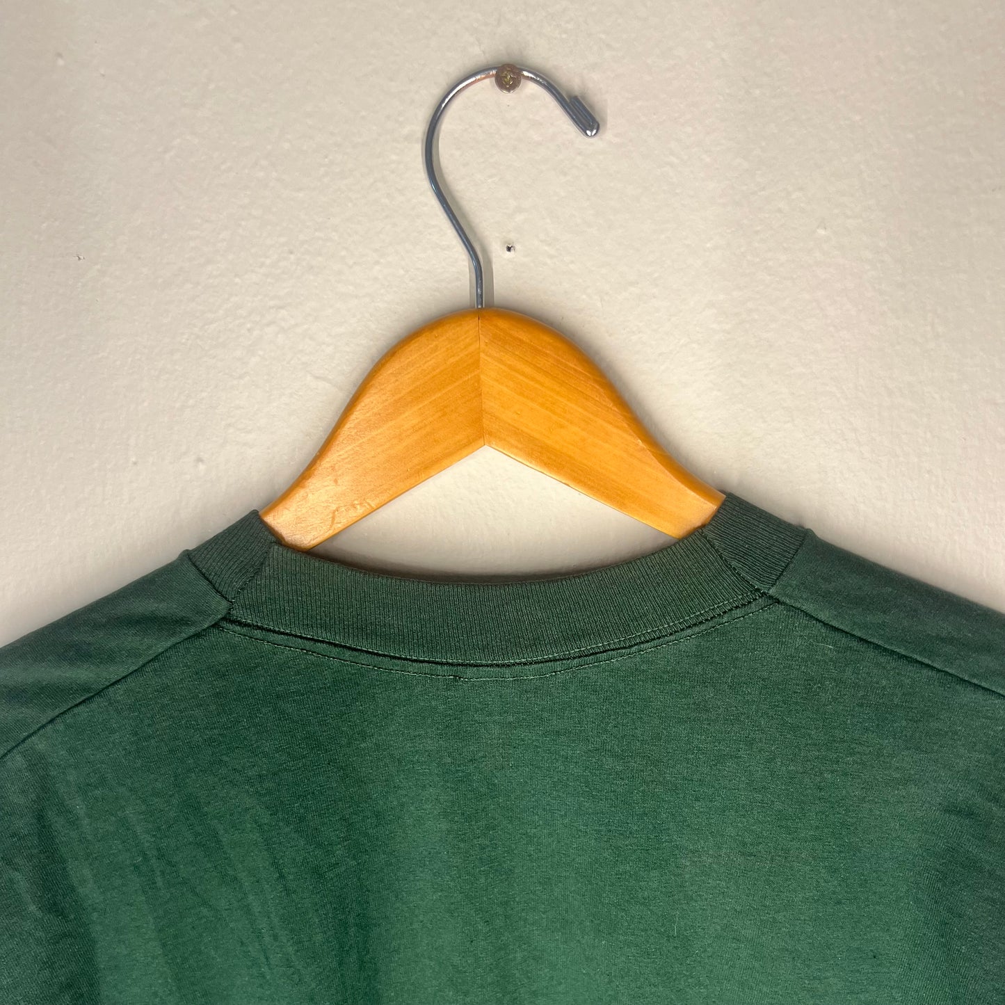 Close-up of neckline seam and shoulder stitching on vintage Nirvana tee.