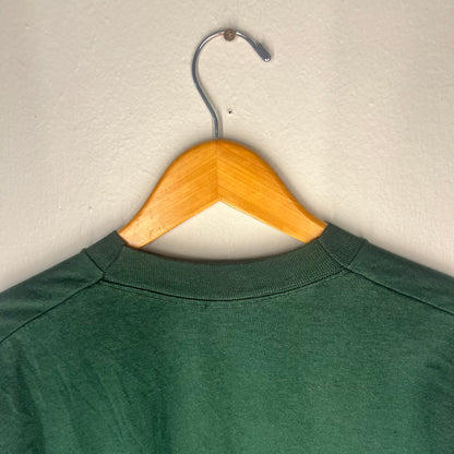 Close-up of neckline seam and shoulder stitching on vintage Nirvana tee.