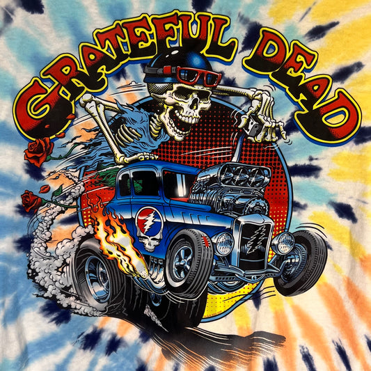 Close-up of Grateful Dead graphic featuring skeleton driving hot rod with flames