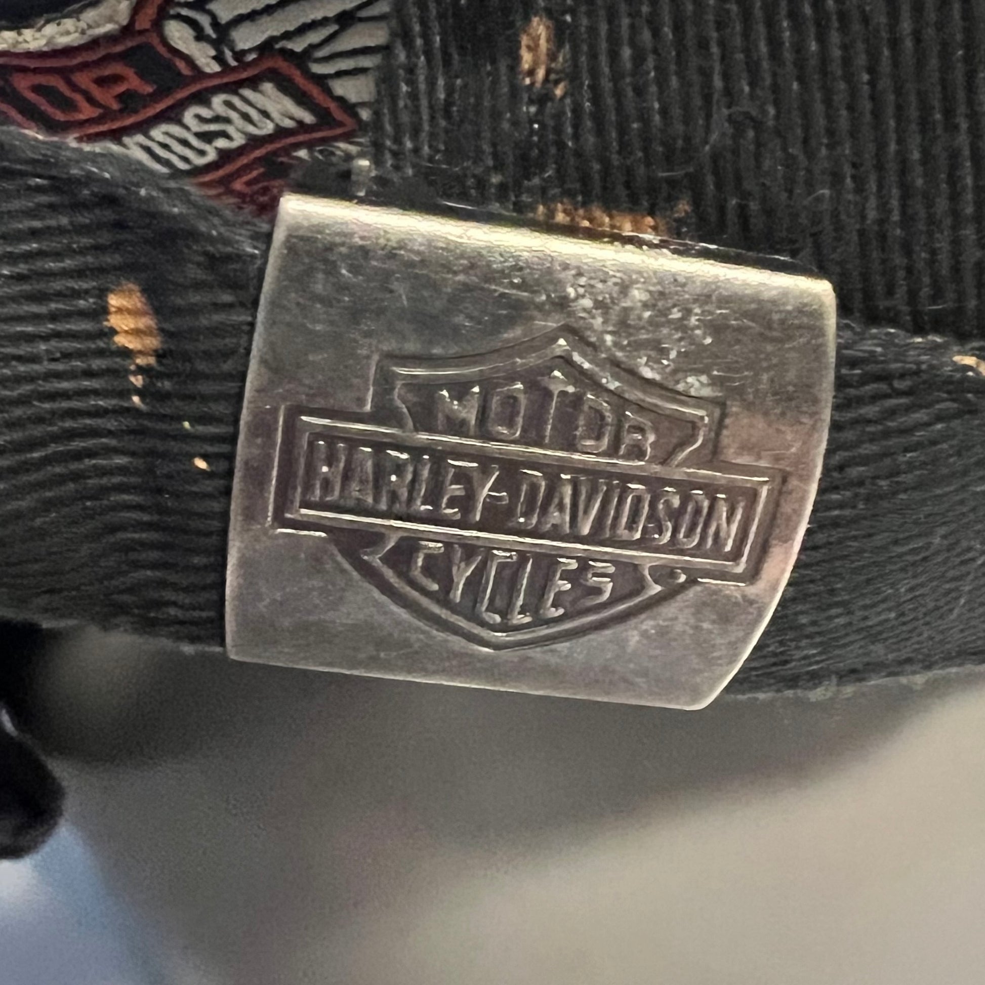 Close-up of metal Harley-Davidson clasp on adjustable strap