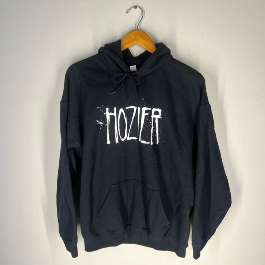 Front view of Hozier black hoodie with bold splatter-style logo (XL)