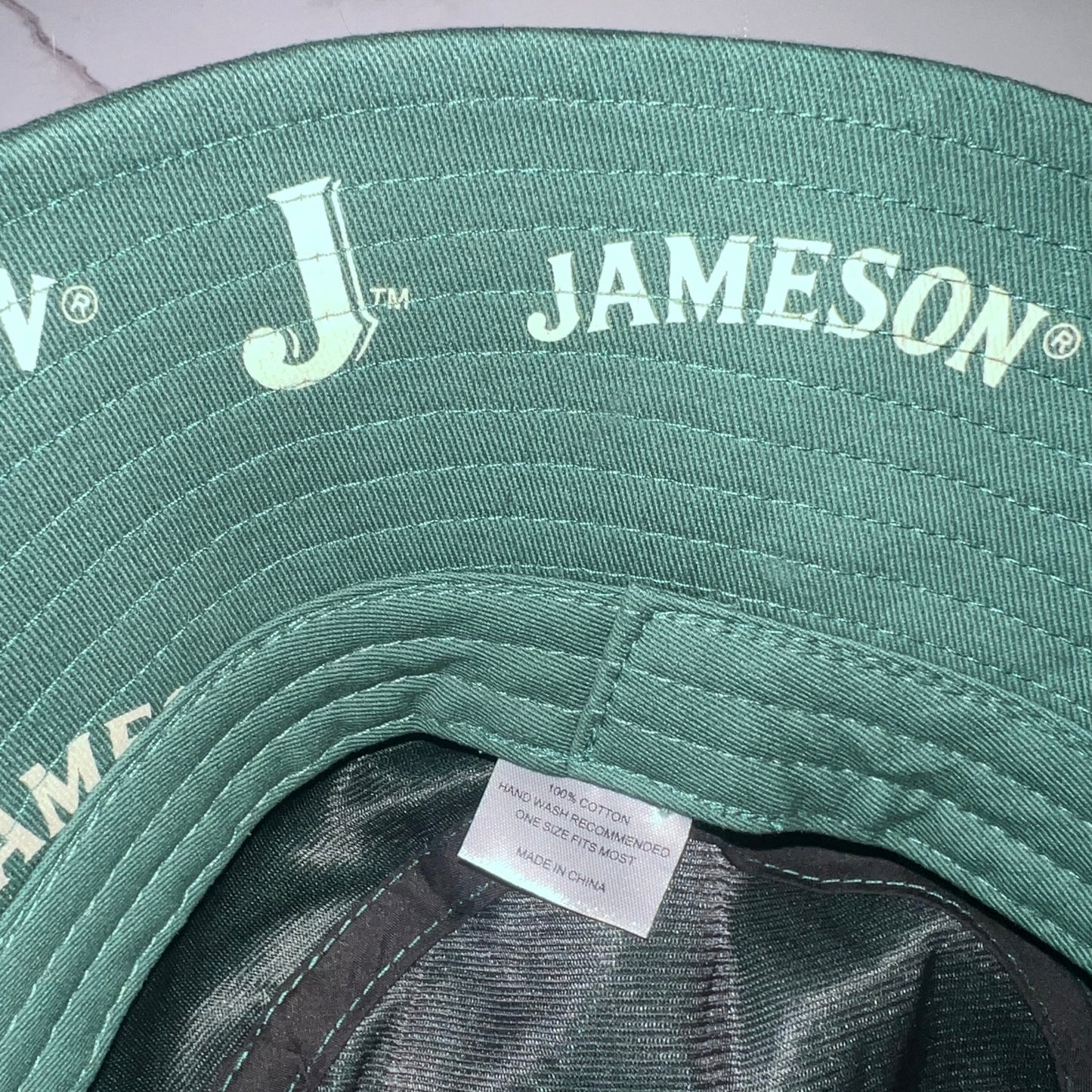 Interior care tag showing 100% cotton and made in China