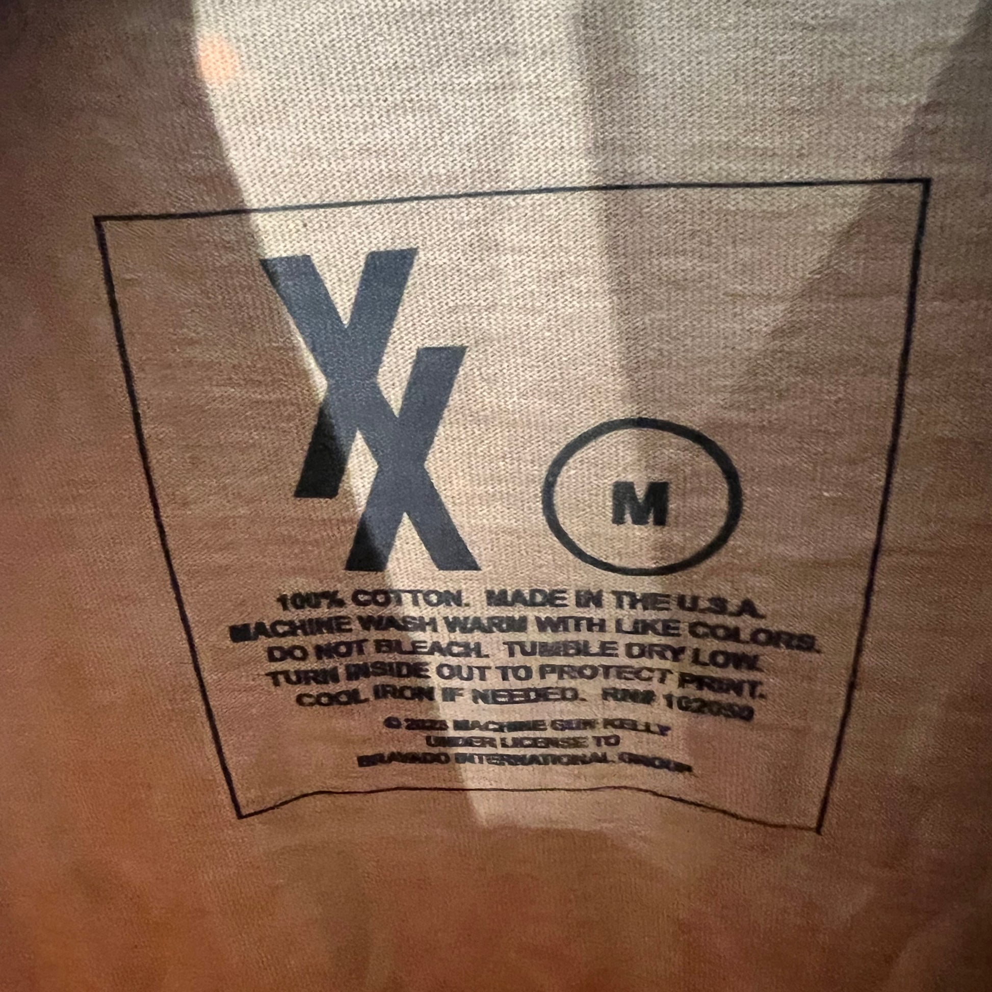nside tag showing Made in USA, size M, 100% cotton