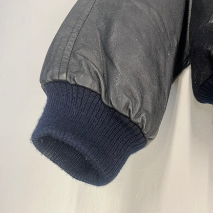 Ribbed knit cuff and leather sleeve detail