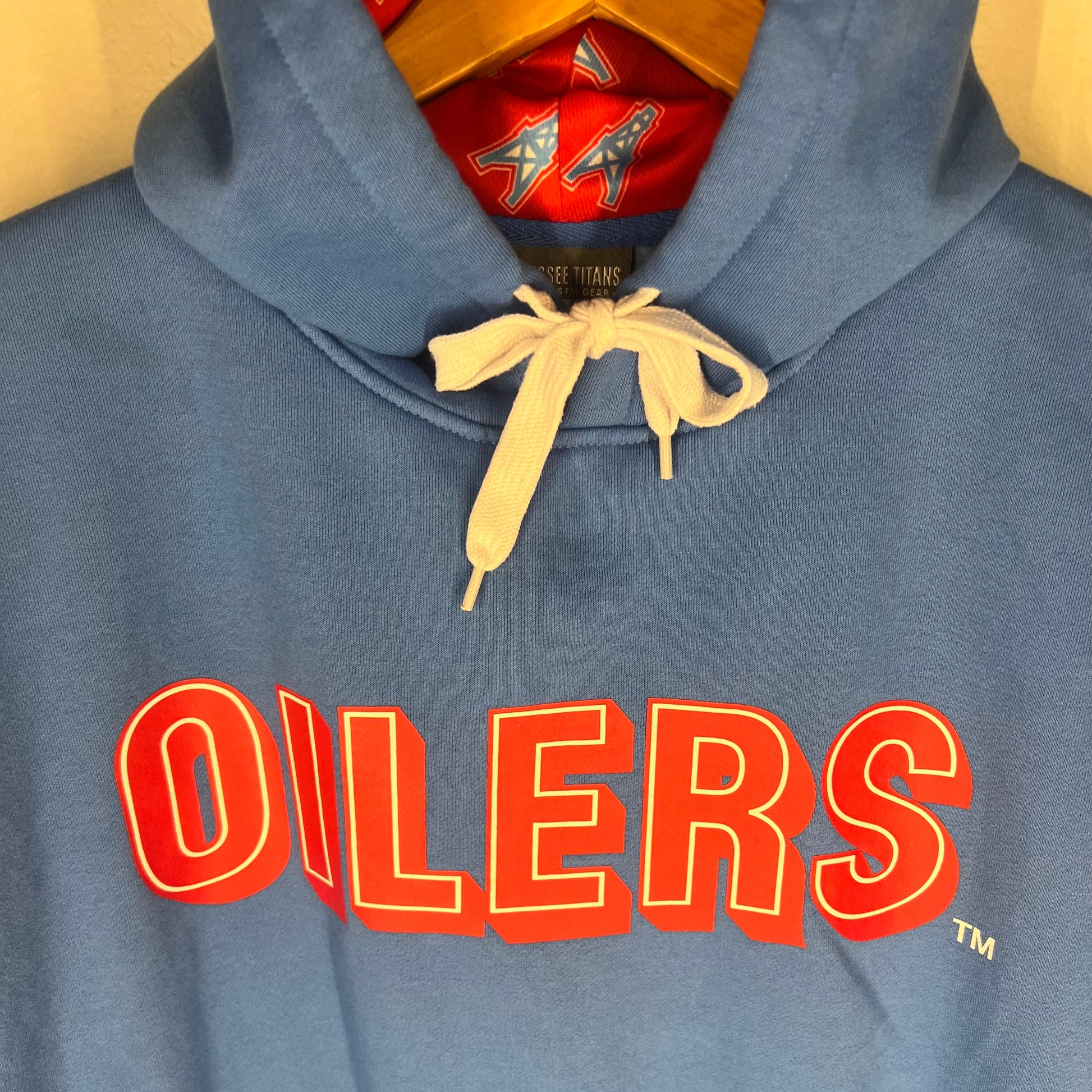 Detail of bold red “OILERS” chest print with white outline