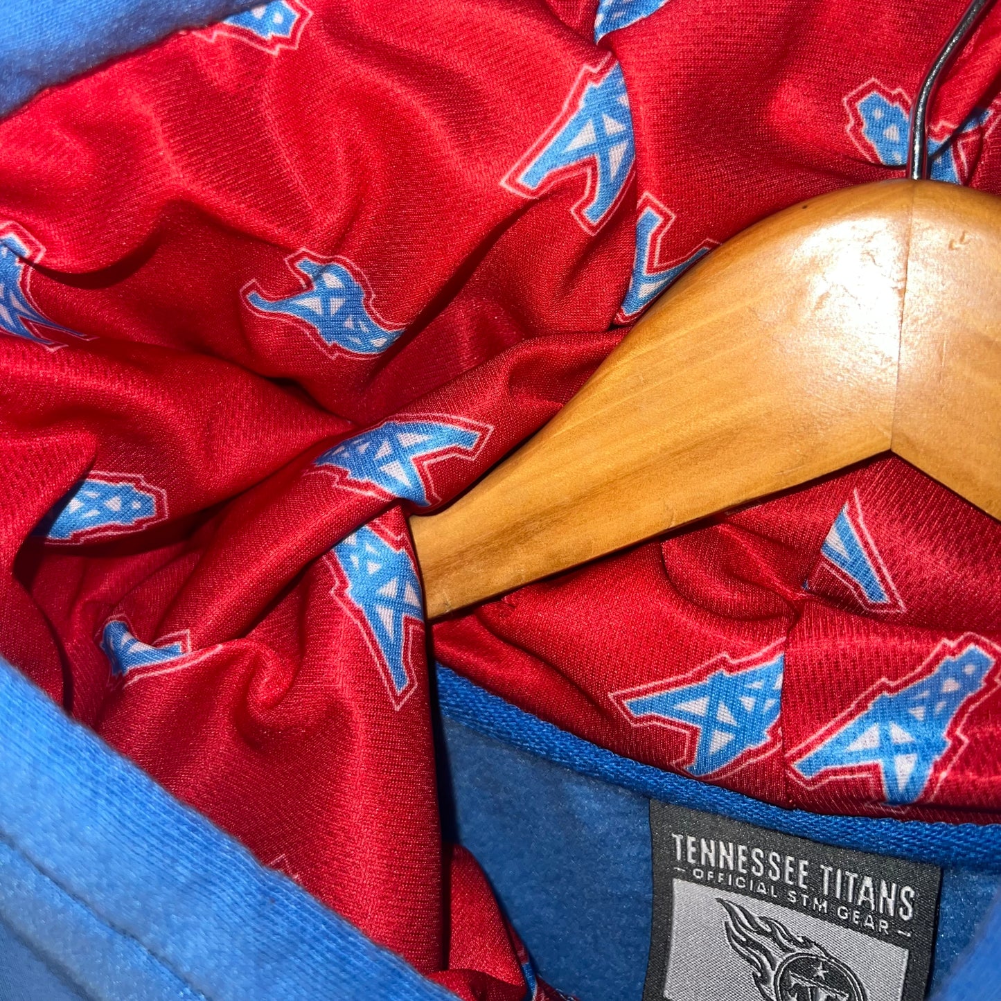Red satin hood lining with repeating Oilers derrick logo print