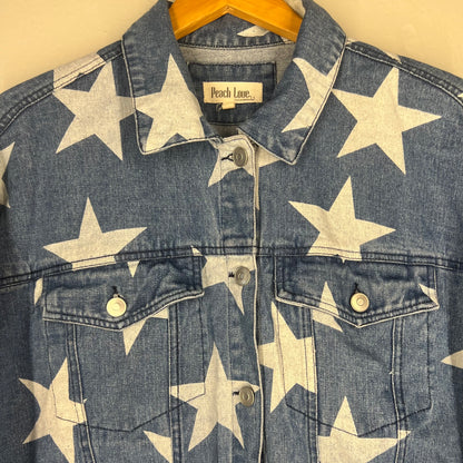Close-up of chest pockets, button placket, and star print details