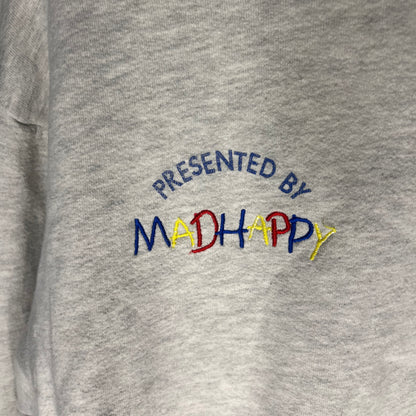 Close-up of 'Presented by Madhappy' embroidery on hoodie