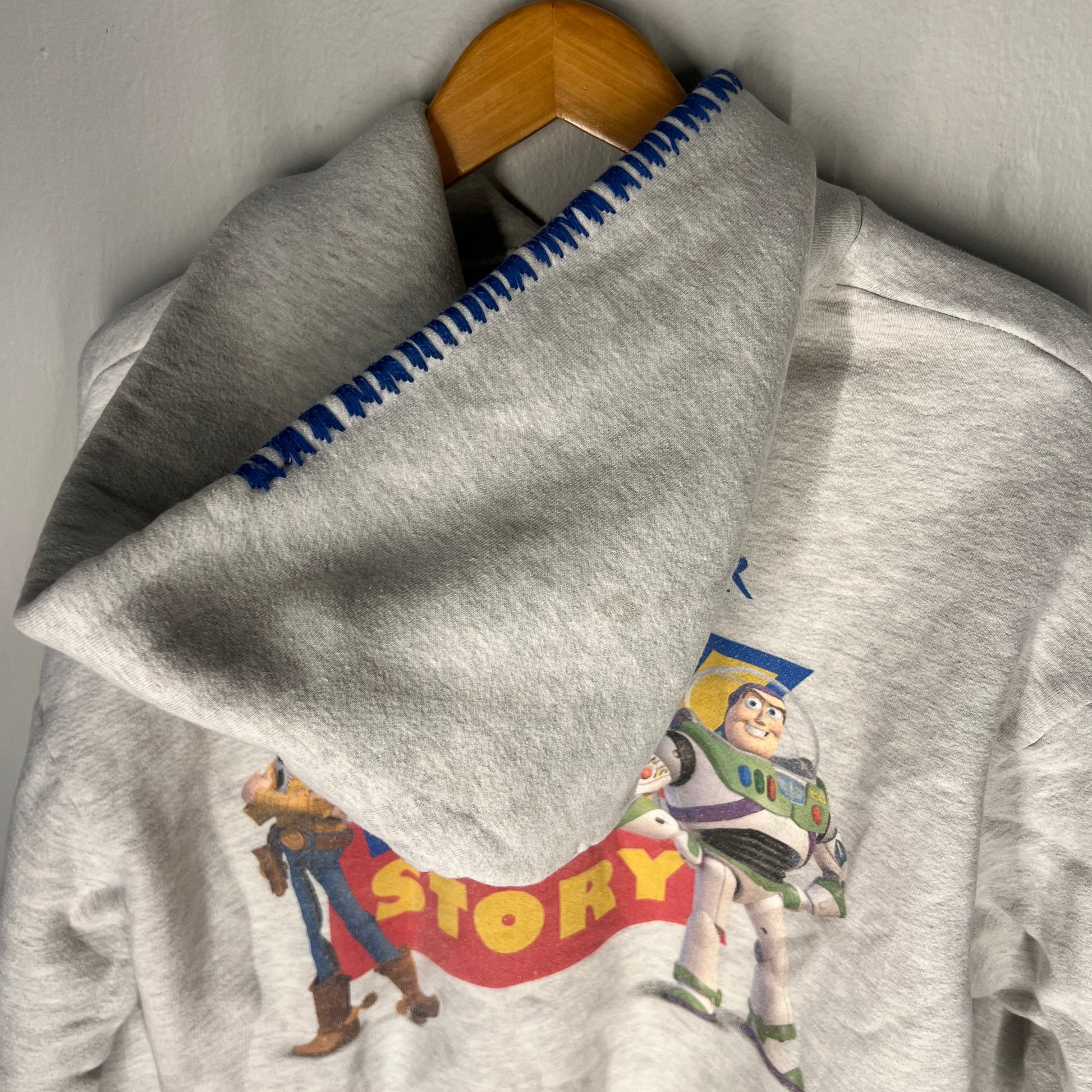 Blue whipstitch trim detail on hoodie hood