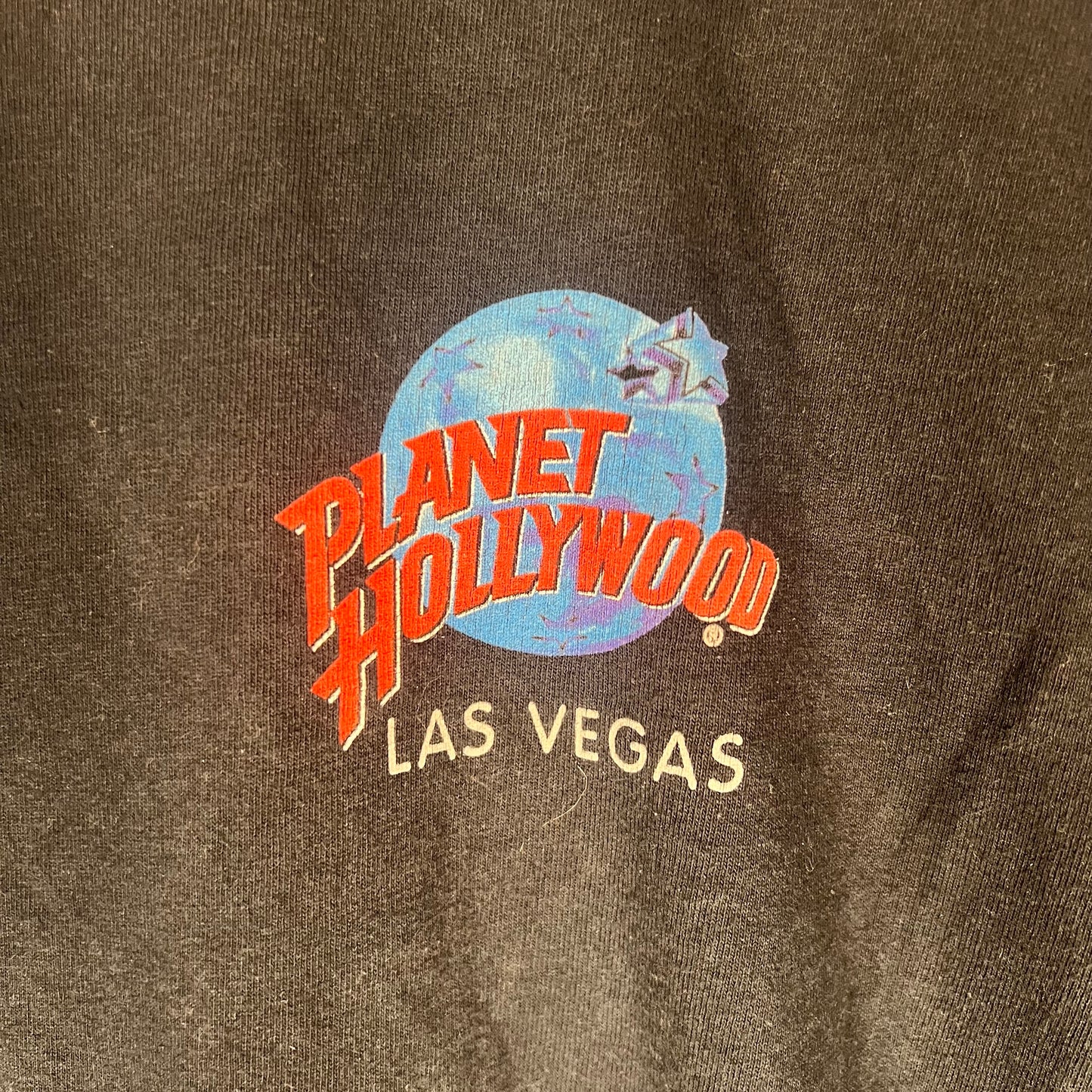 Close-up of chest logo — Planet Hollywood Las Vegas graphic print