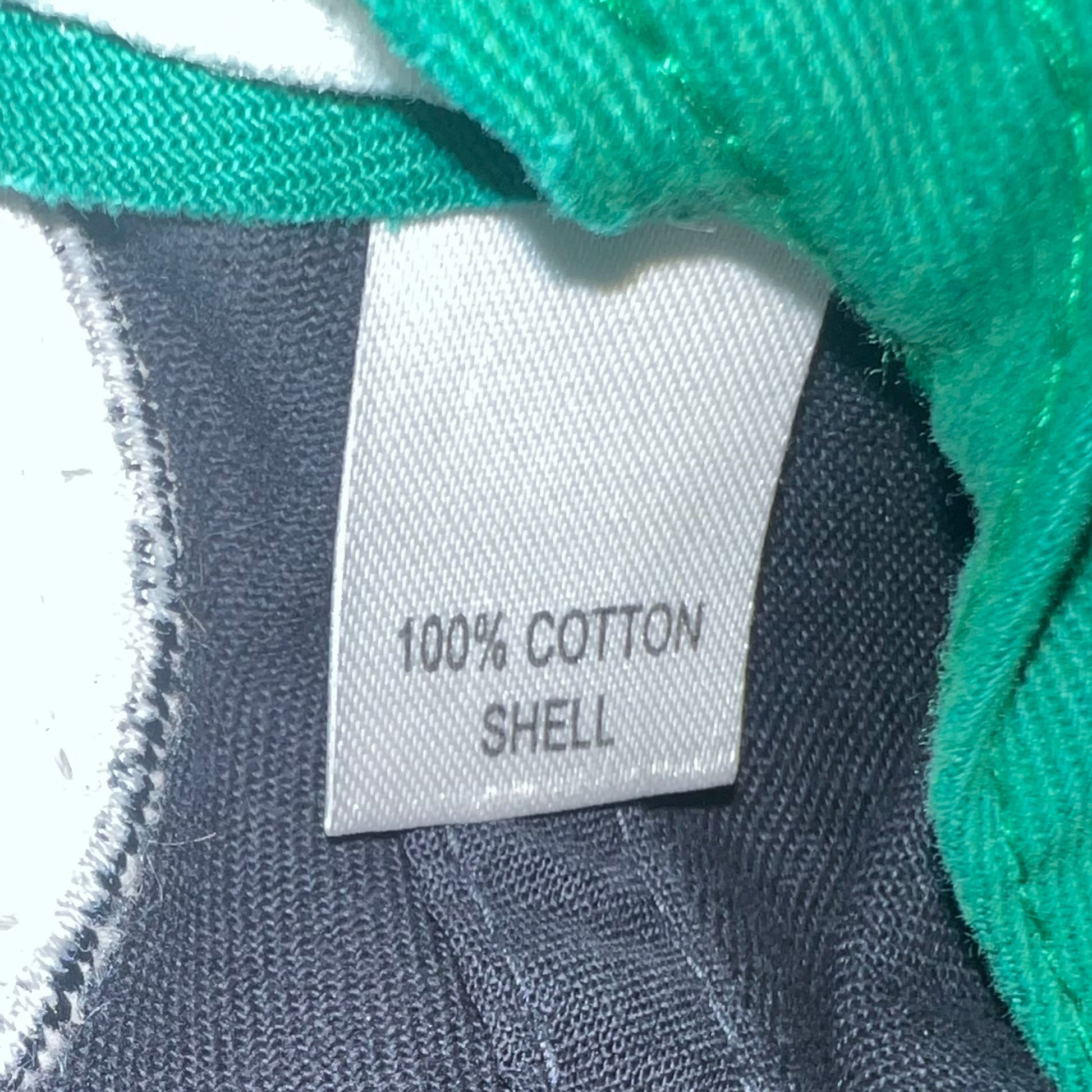 Interior tag showing "100% Cotton Shell"