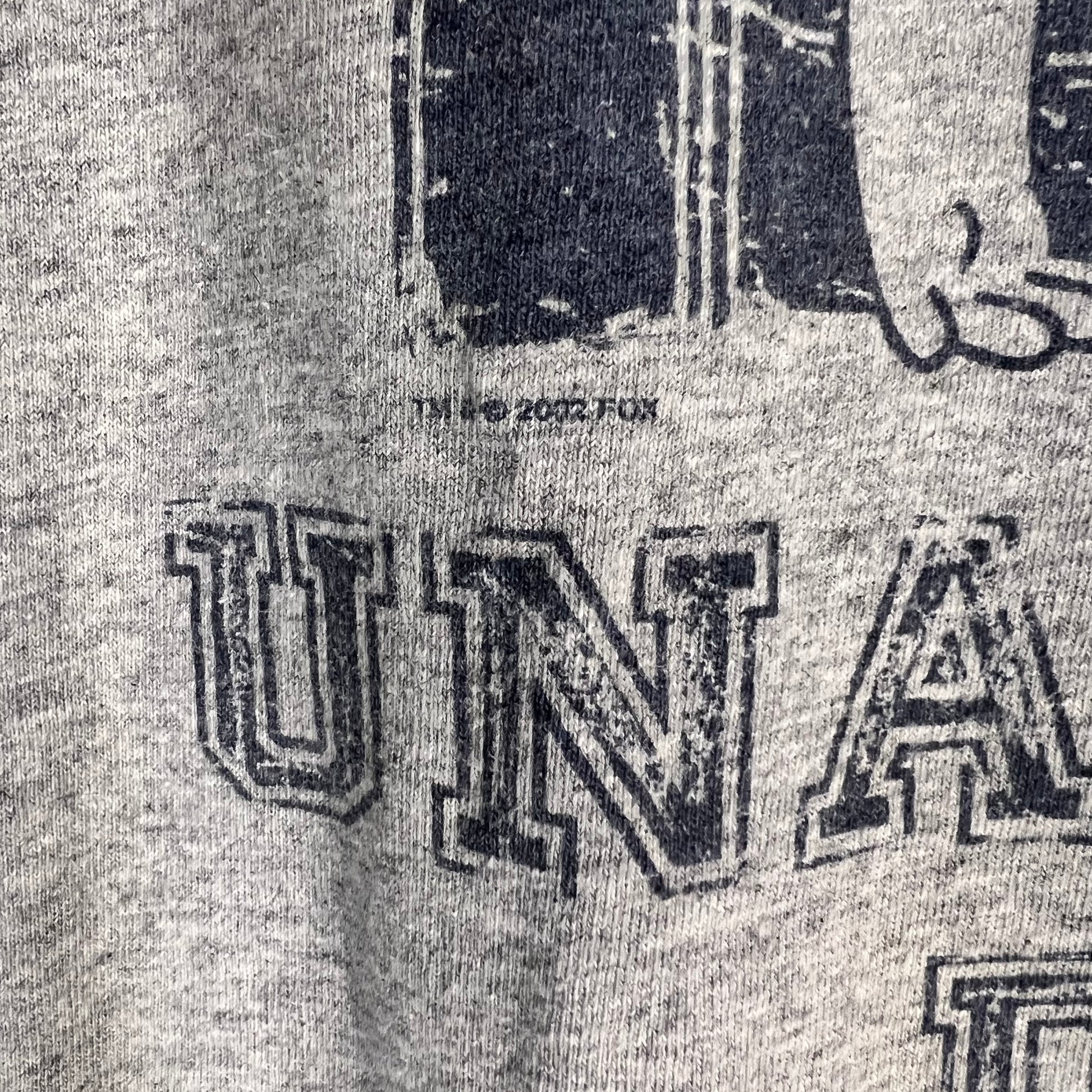 Copyright detail showing 2002 FOX marking on Simpsons T-shirt
