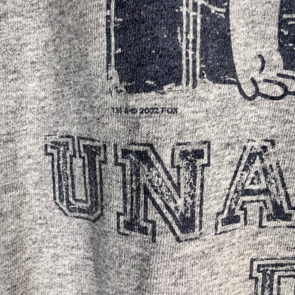 Copyright detail showing 2002 FOX marking on Simpsons T-shirt