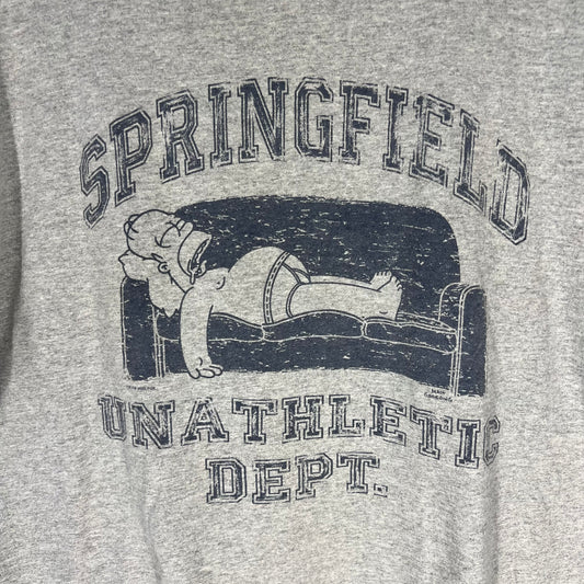 Close-up of Simpsons Springfield Unathletic Dept graphic with Homer Simpson on couch