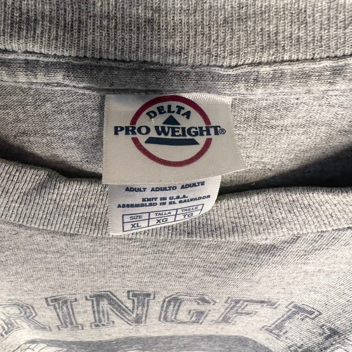 Delta Pro Weight neck tag close-up size XL assembled in El Salvador